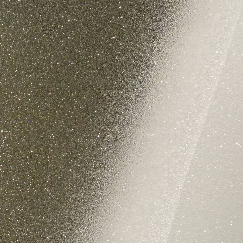 Close-up of the frosted film’s crystal grain, sparkling where the light hits it.