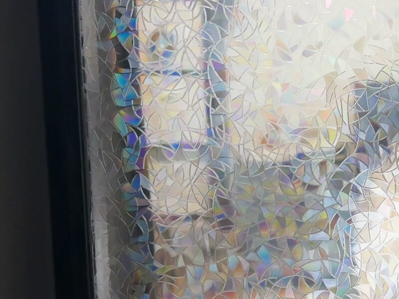 The same rainbow film at night with no direct sun: a textured stained-glass look, no rainbows cast.
